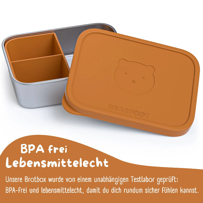 Madkasse med plads til 1200ml lavet af rustfrit stål med brunt silikonelåg og en bamse på toppen.