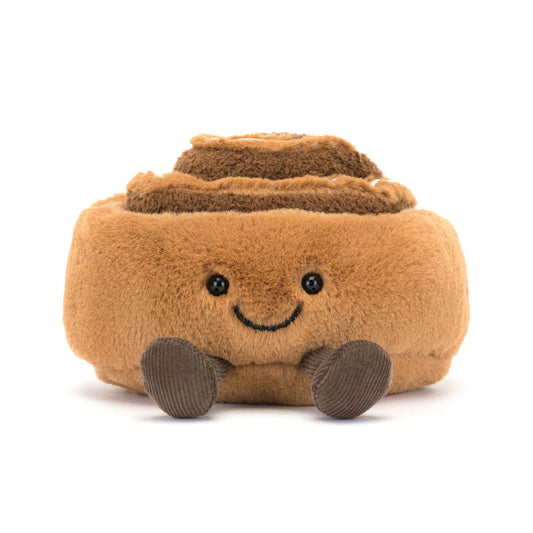 Jellycat bamse, som forestiller en kanelsnegl med et smilende ansigt og små ben.