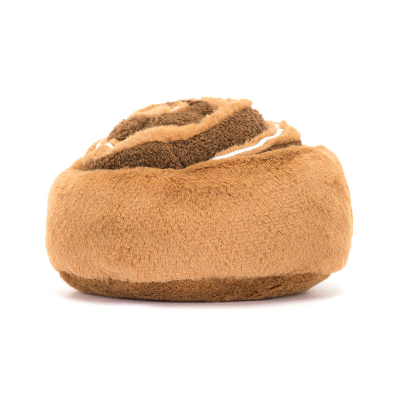 Jellycat bamse, som forestiller en kanelsnegl med et smilende ansigt og små ben.