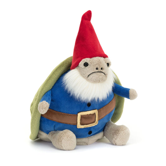 Jellycat bamse, som er en småsur skildpadde iført en mørkeblå trøje og brun bælte, som sidder under hans grønne skjold. Med sin røde nissehue og bløde, cremefarvede skæg er Timmy den mest gnavne nisse i byen.