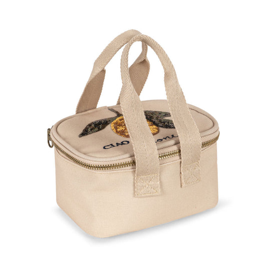 Lille beige termotaske med citronmønster på toppen.