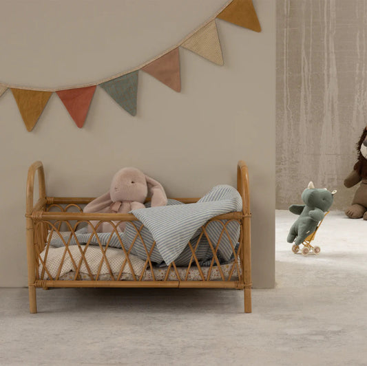 Lyserød plyskanin med sløjfe.