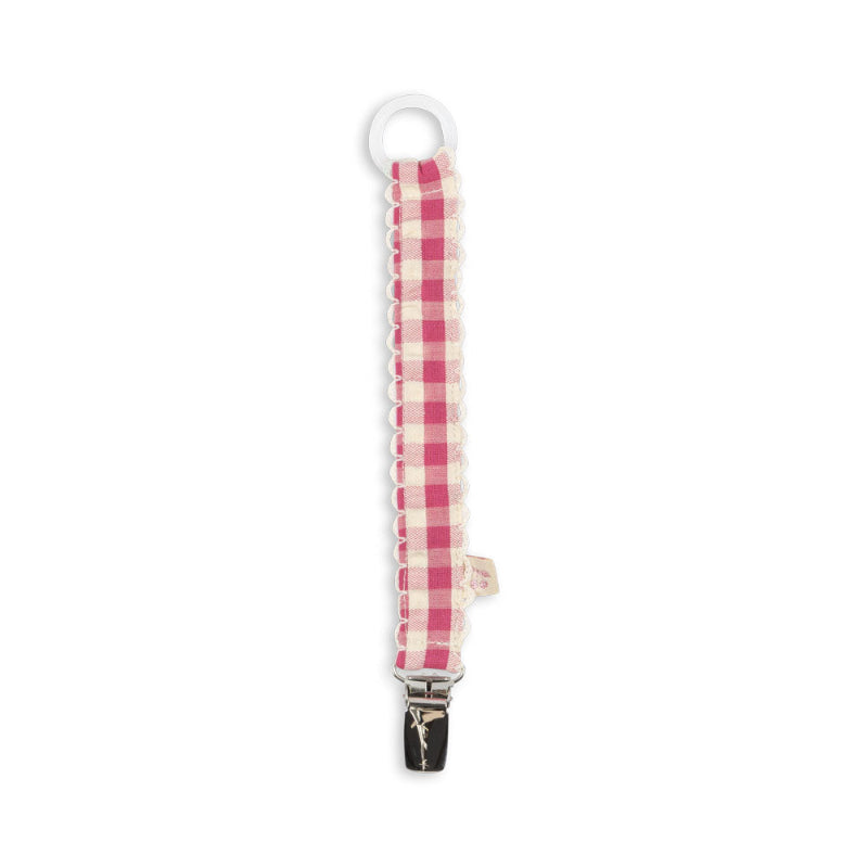 Suttesnor med pink ternet mønster.