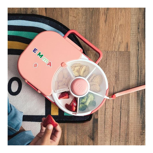 Madkasse med snack spinner i lyserød.