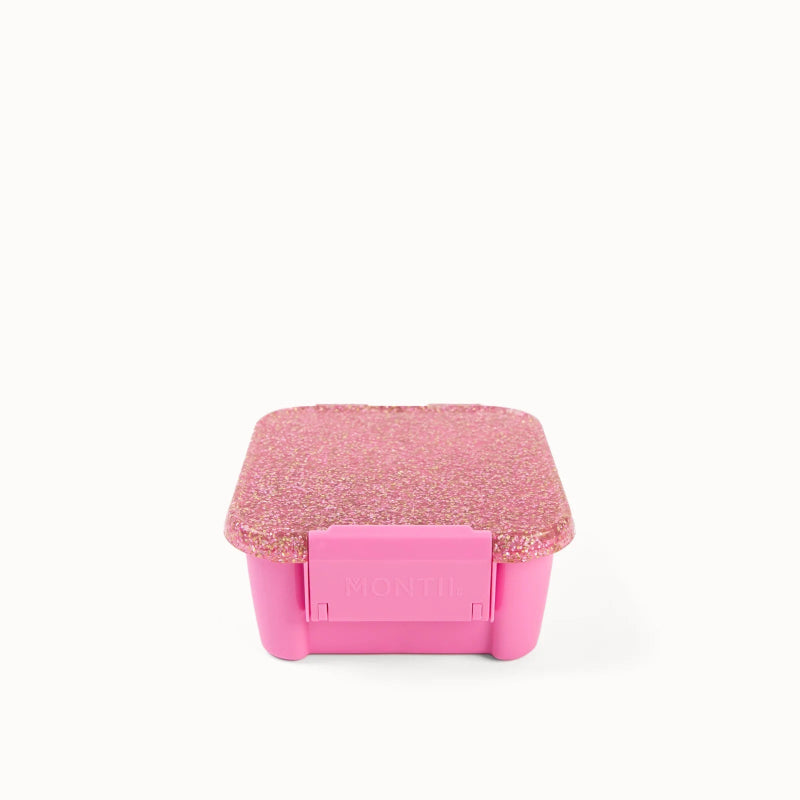 Lyserød snack madkasse med glitter låg.