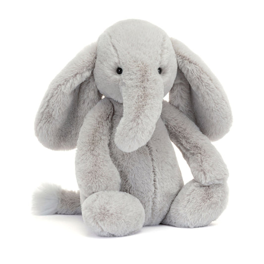 Grå bamse elefant med store runde ører og snabel. 