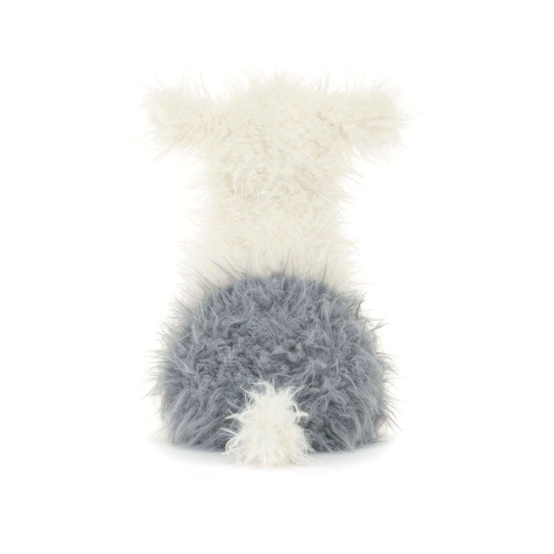 Hvid og grå hunde bamse med pjusket pels.