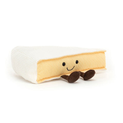 Brieformet bamse med sødt smil og små ben.
