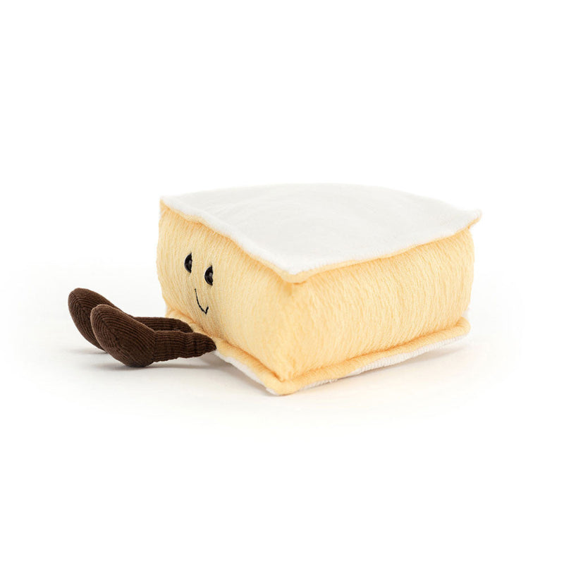 Brieformet bamse med sødt smil og små ben.