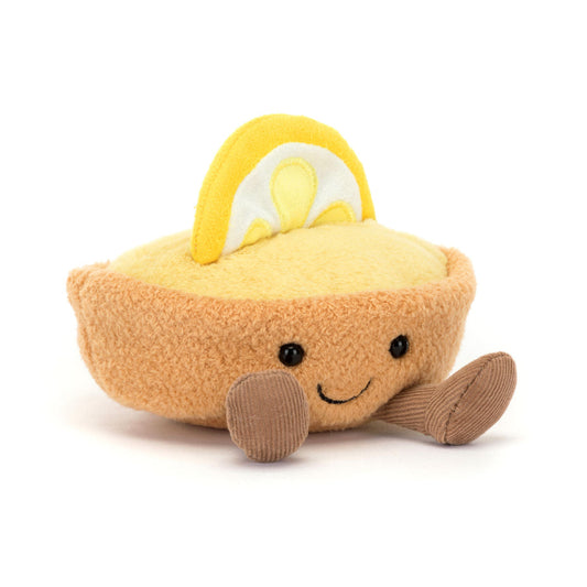 Jellycat bamse formet som en citrontærte med brun bund, creme og dekoreret med en citron på toppen. 