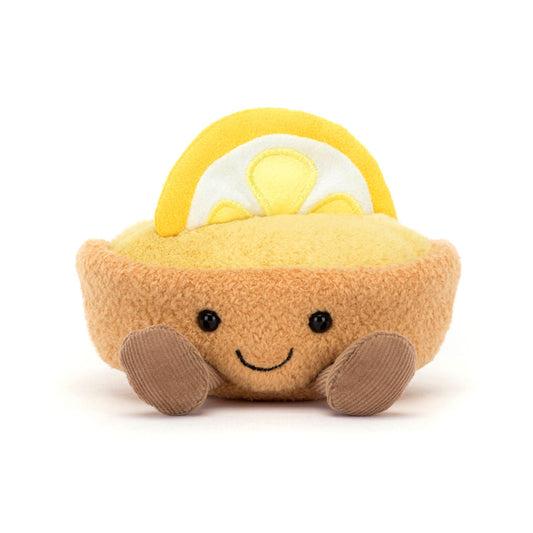 Jellycat bamse formet som en citrontærte med brun bund, creme og dekoreret med en citron på toppen. 