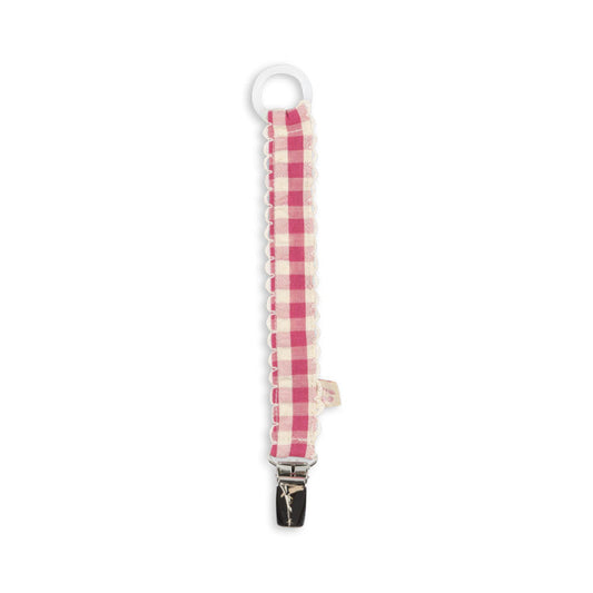 Suttesnor med pink ternet mønster.