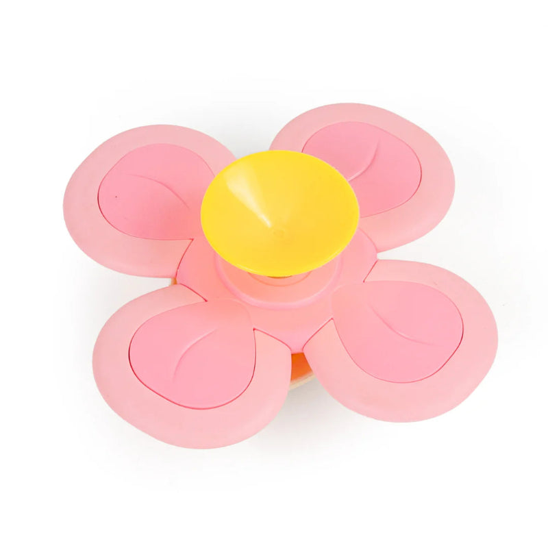 Lyserød spinner med kanin og sugekop bagpå.