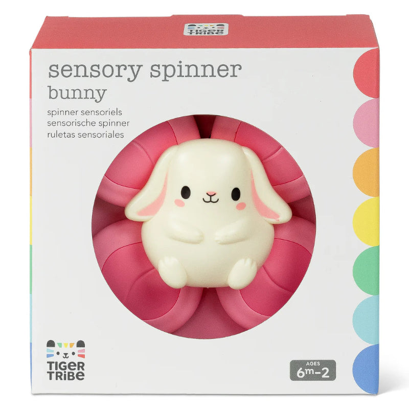 Lyserød spinner med kanin og sugekop bagpå.