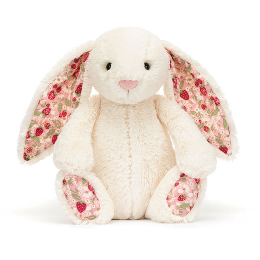 Creme kaninbamse med jordbærprint i ørerne.