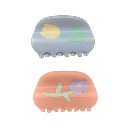 Hårklemmer med blomster.