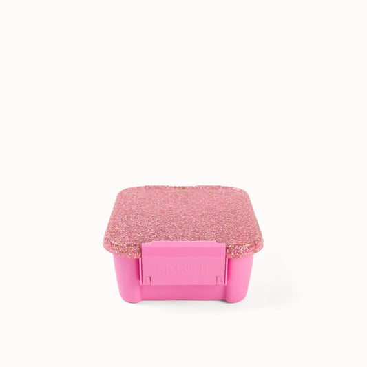 Lyserød snack madkasse med glitter låg.