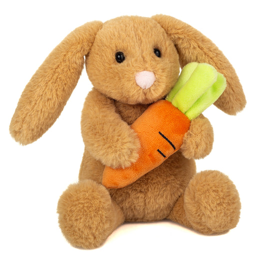 Brun kanin bamse, som holder en gulerod.