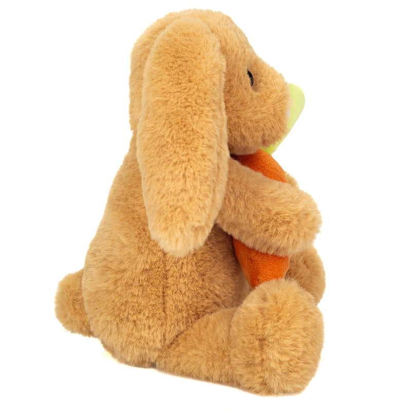 Brun kanin bamse, som holder en gulerod.
